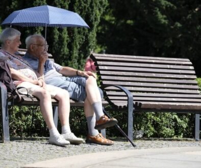 Elderly couple sitting on a park bench