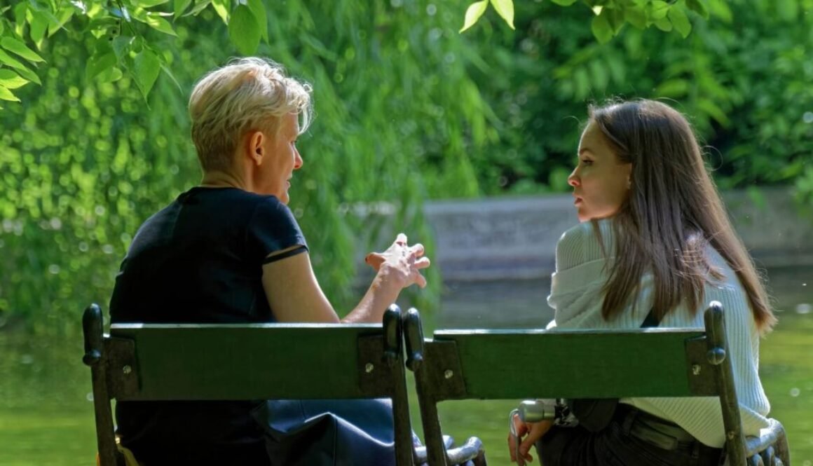 People chatting on a bench