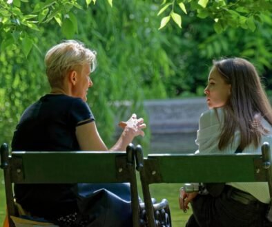 People chatting on a bench