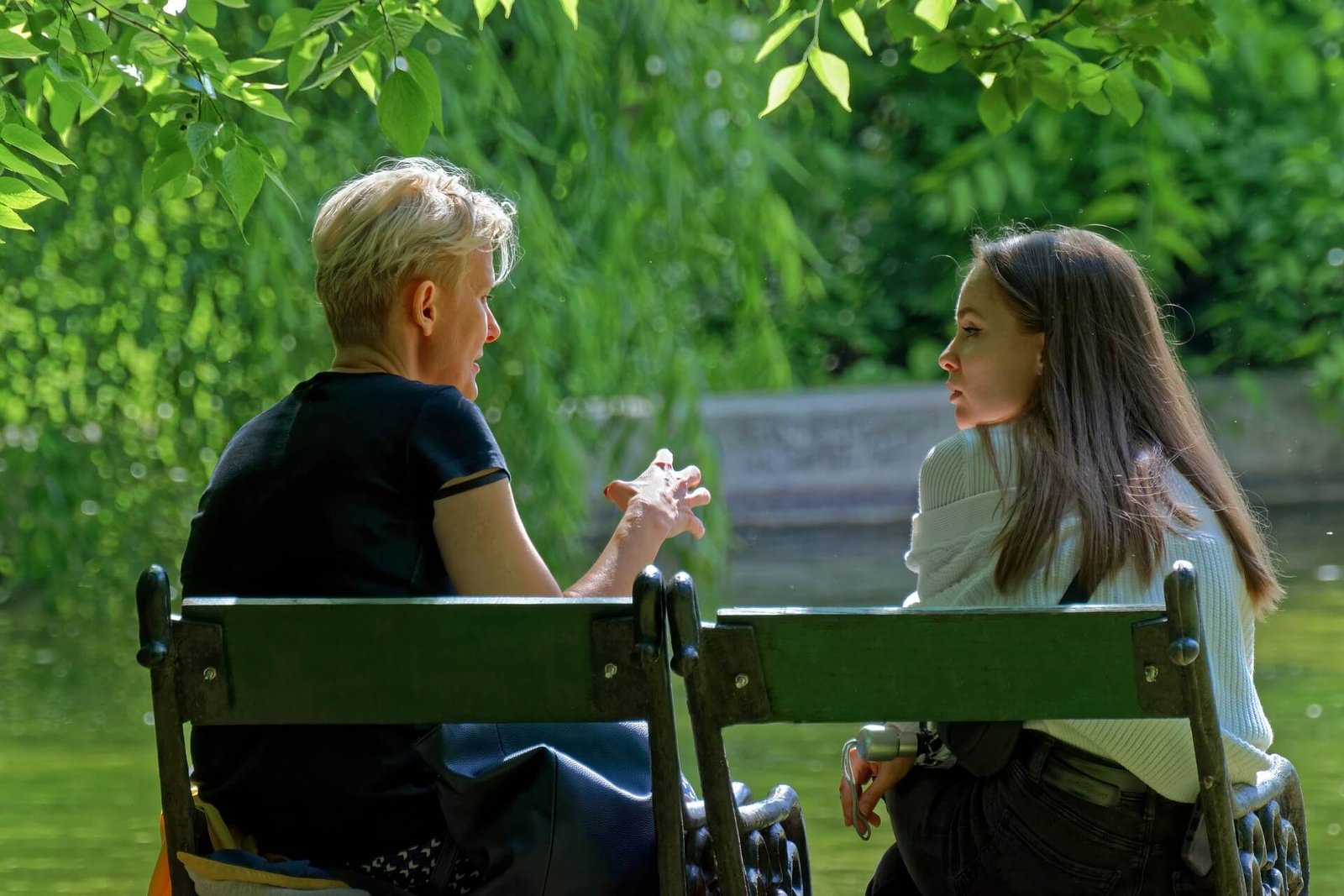 People chatting on a bench