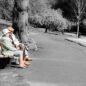 Elderly couple on a park bench Elderly couple sitting on a park bench
